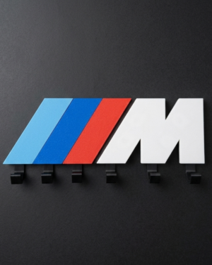 M logo key holder flat lay showing blue red white design and 6 black hooks